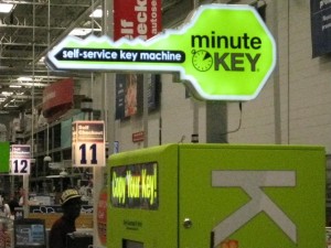 a green minute key kiosk in hardware store