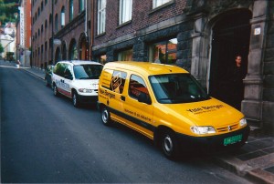 John Didier took this photo of a Yale yellow locksmith van, and a Norwegian locksmith working on a door in Bergen.