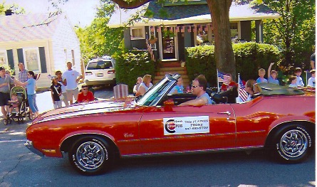 Jeff Parcell drives his restored '72 Oldsmobile Cutlass convertible in the Des Plaines' Fourth of July parade to raise awareness of Crime Stoppers.