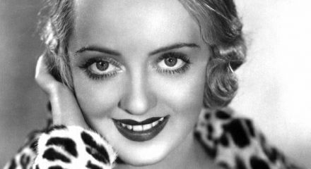 Black and White Photo of Bette Davis with Eyes Staring into Viewer