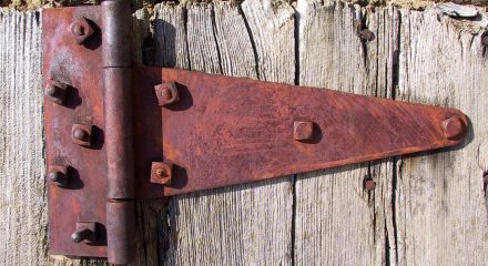 Rusty Door Hinges on Barn Door